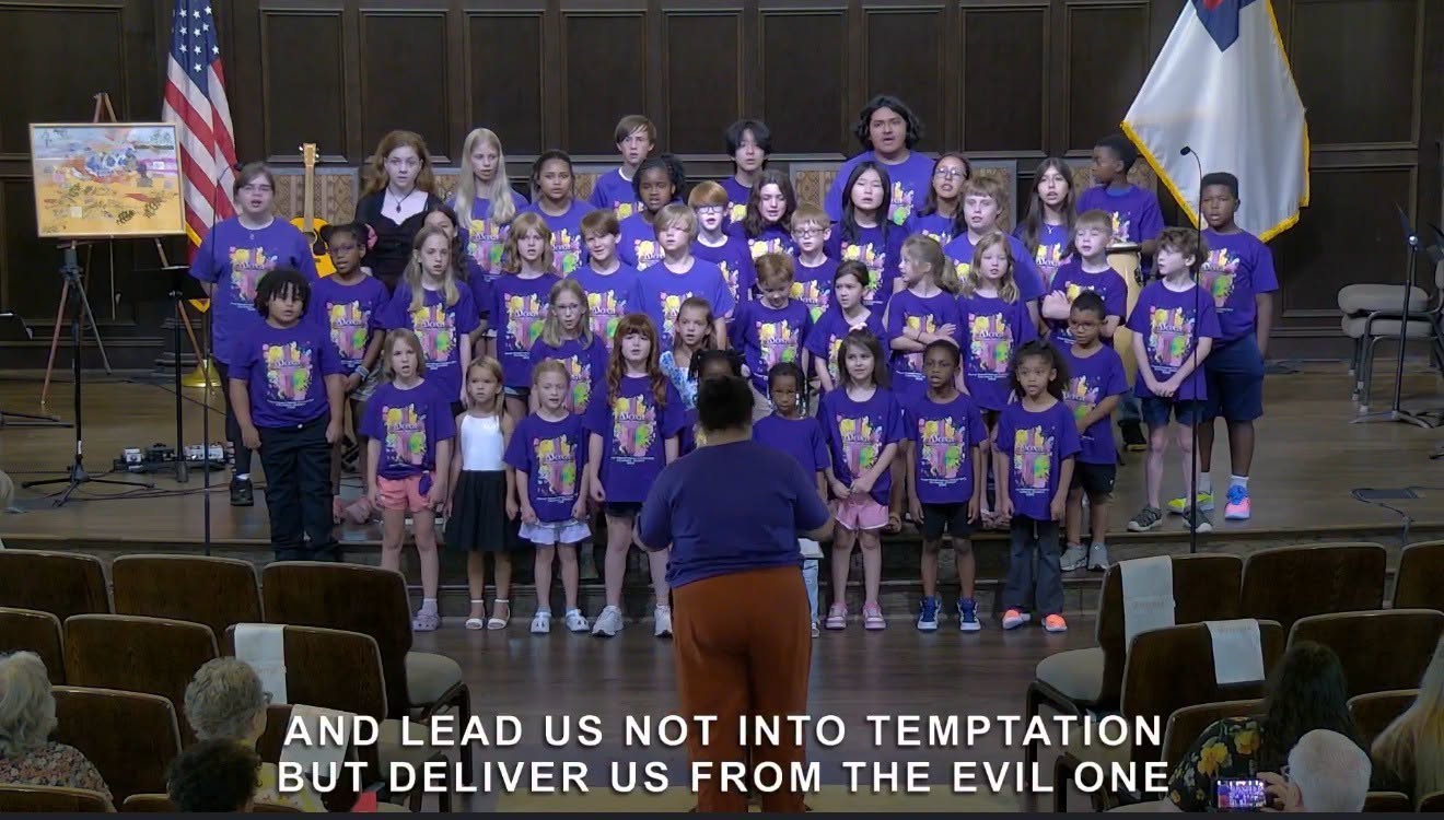 Children singing together in the sanctuary during camp week