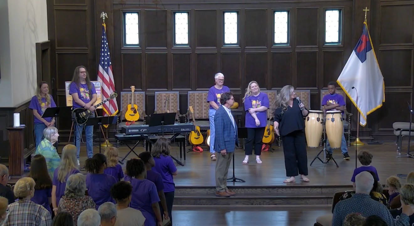 Leaders and children on stage during Worship Arts Camp