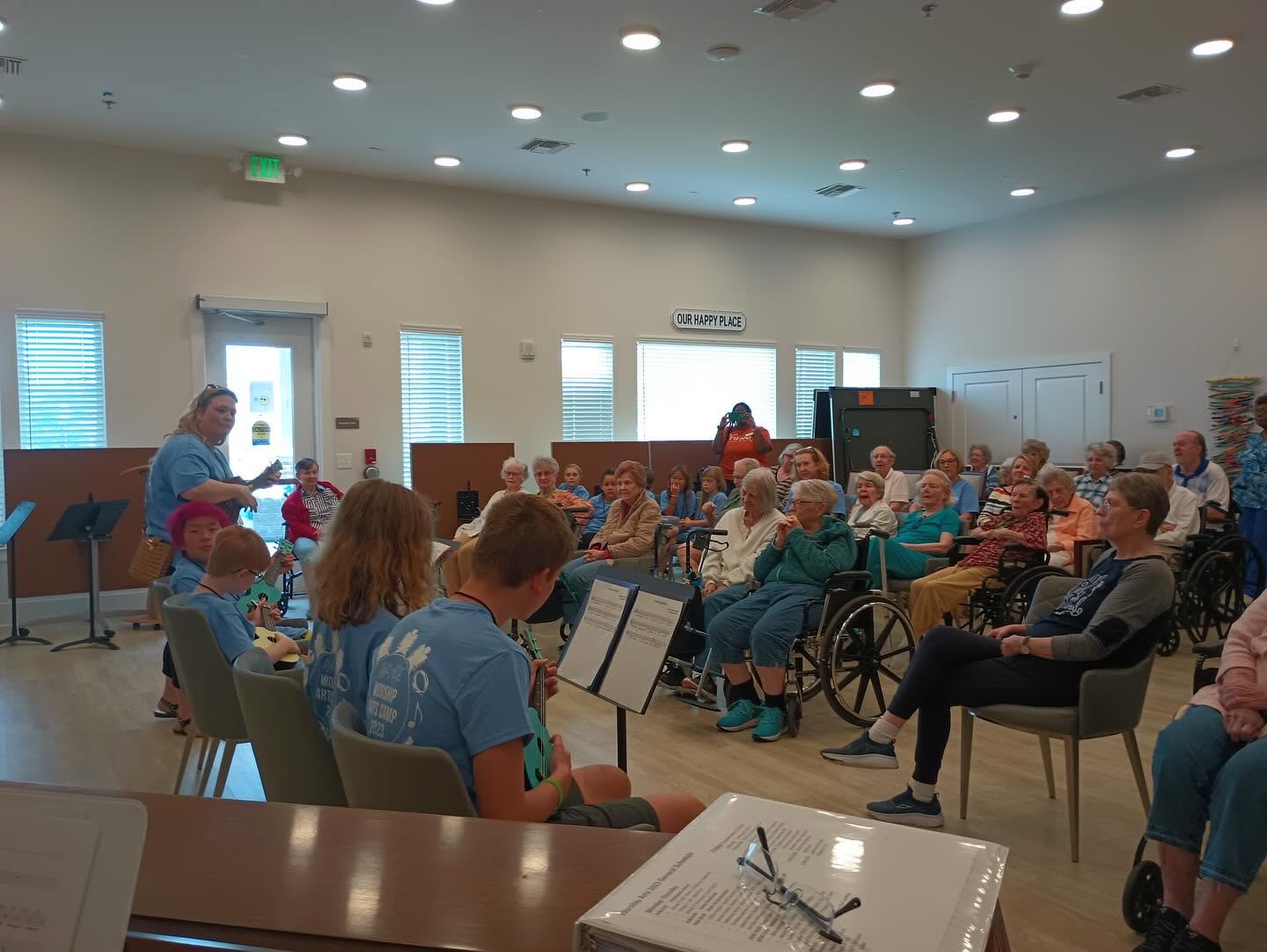 The children's choir singing at a senior home