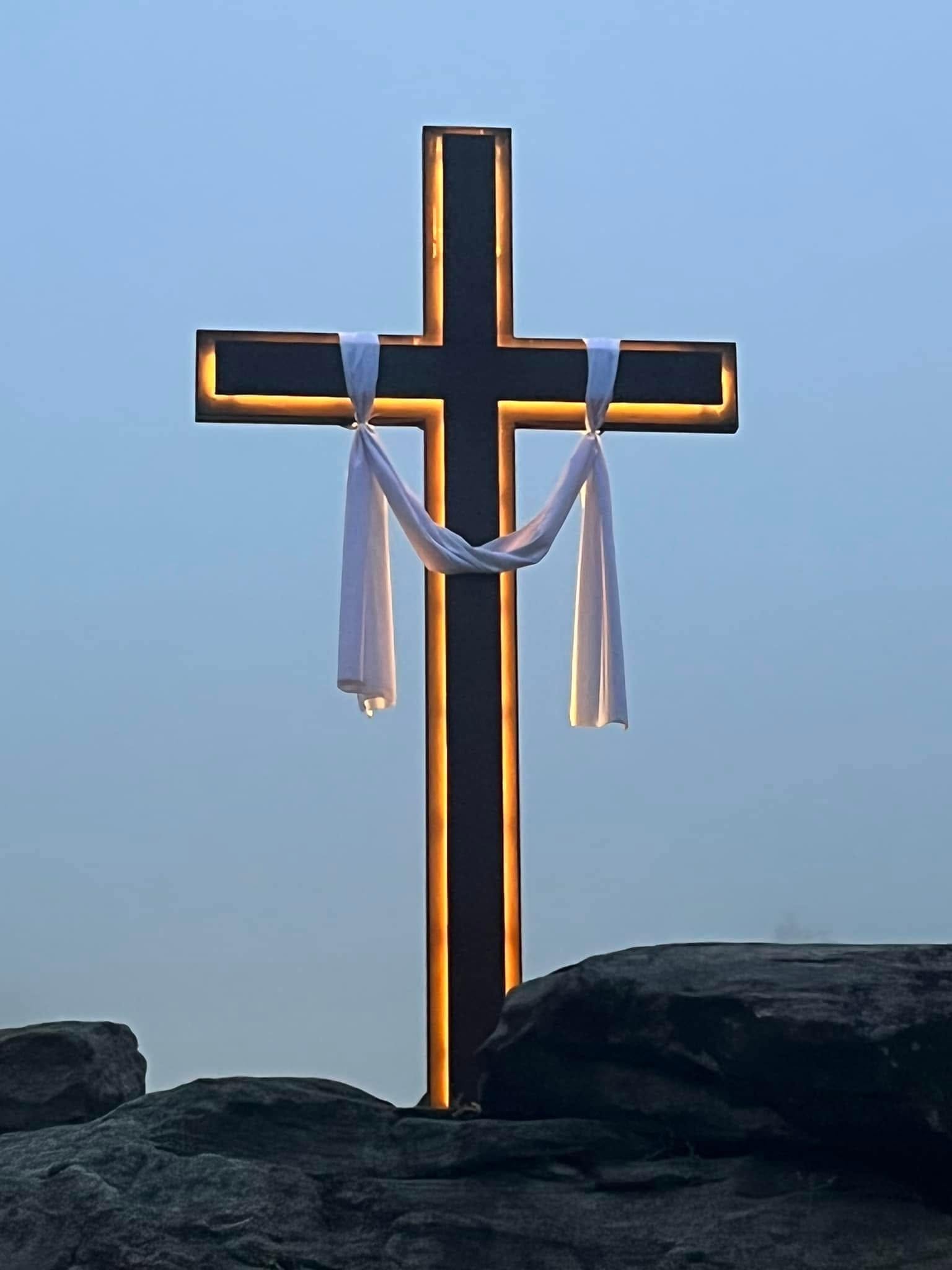 The cross on the stones before the sanctuary in daylight
