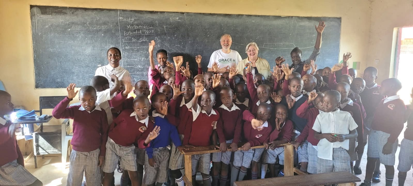 A Wachara classroom, hands raised