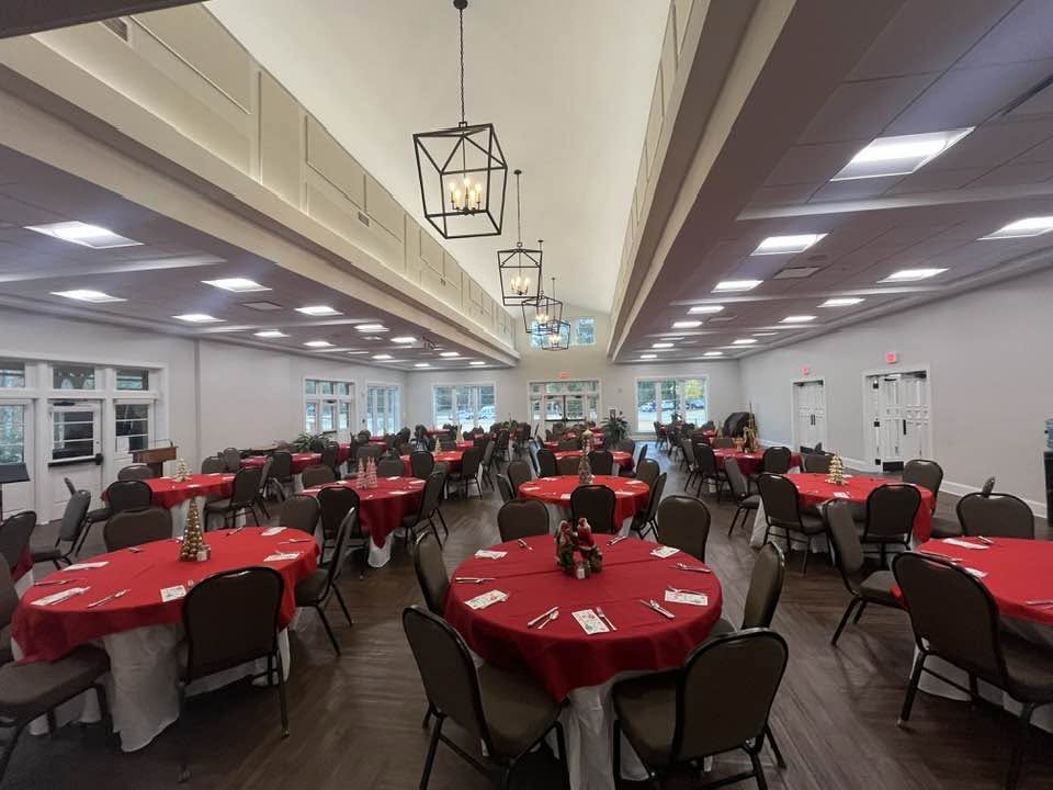 The hall set for supper in red
